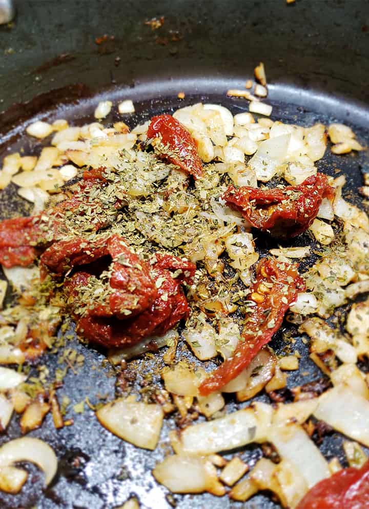 Chicken Tinga Tostadas Recipe - Spices Toasting In Pan