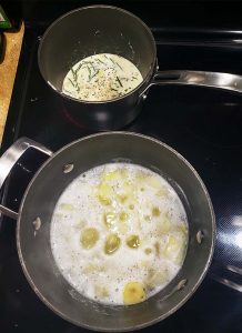 Potatoes boiling with flavored cream