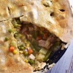 Turkey Pot Pie with slice removed horizontal in cast iron pan