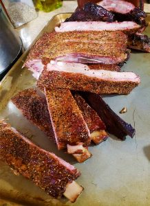 smoked ribs cut on a pan