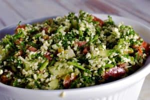 cauliflower tabbouleh in a white serving bowl