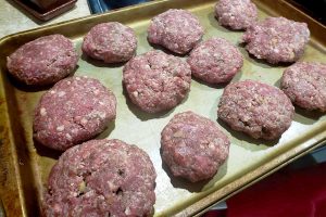 raw lamb kibbeh on baking sheet