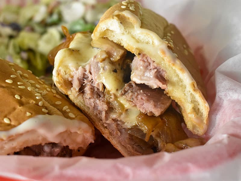 prime rib sandwich in a red basket