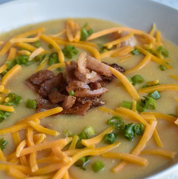 instant pot loaded baked potato soup in a white bowl