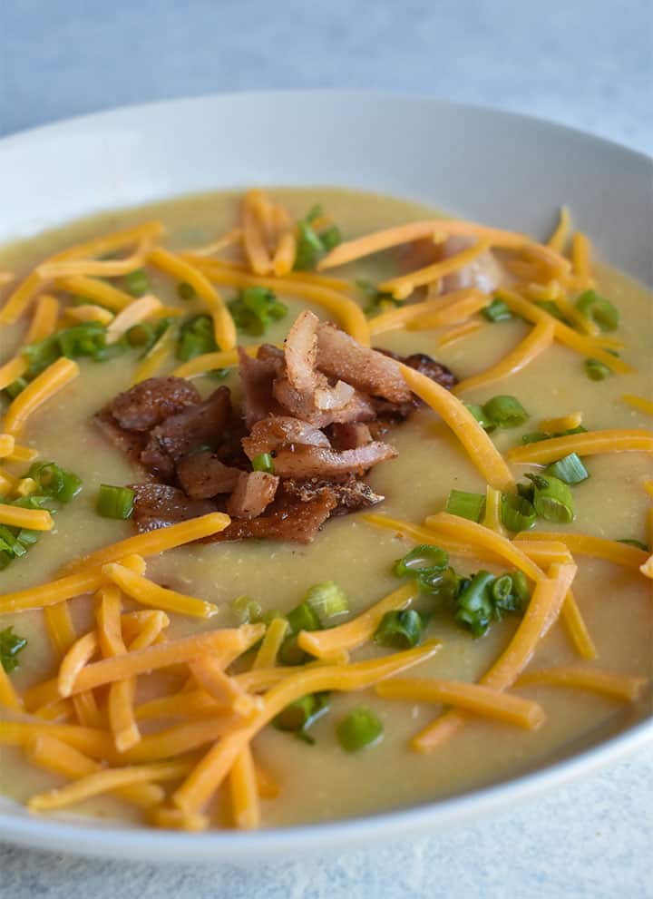instant pot loaded baked potato soup in a white bowl