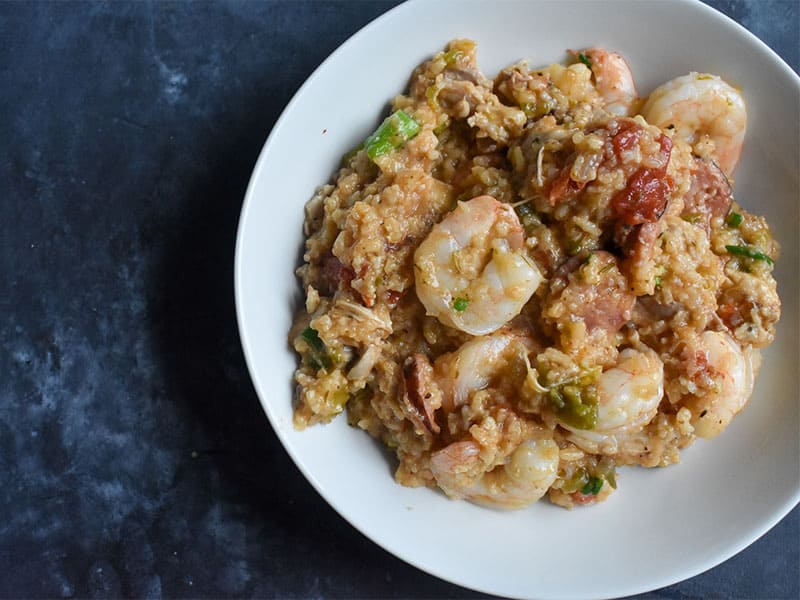 instant pot jambalaya in a white bowl on a slate table