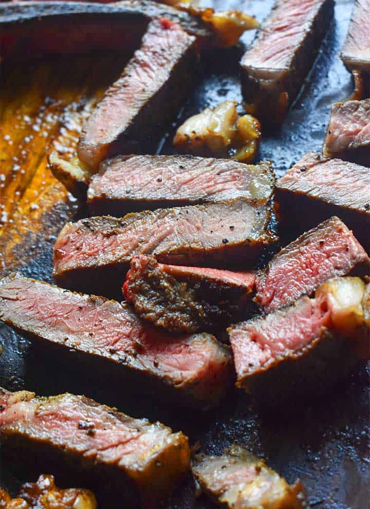 sous vide steak cut on a wooden board